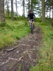 Mike on the rooty singletrack in Broughton Moor forest. 